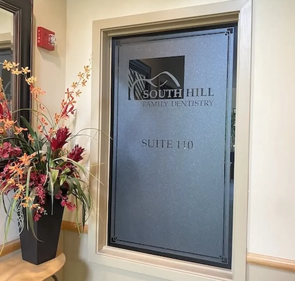 South Hill Family Dentistry Suite 110 window with decorative flowers beside it - Puyallup Dentist South Hill Family Dentistry Suite 110 window with decorative flowers beside it - Puyallup Dentist